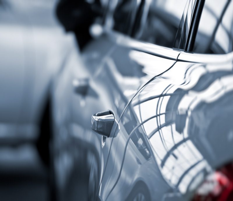 Luxury car at public dealership luxury car with fokus on the handle