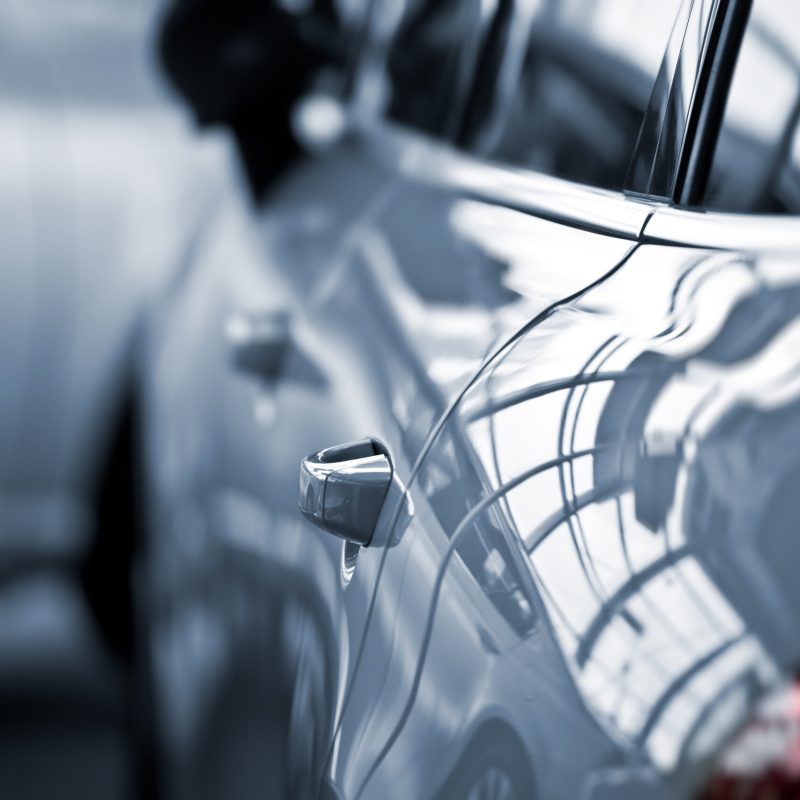 Luxury car at public dealership luxury car with fokus on the handle